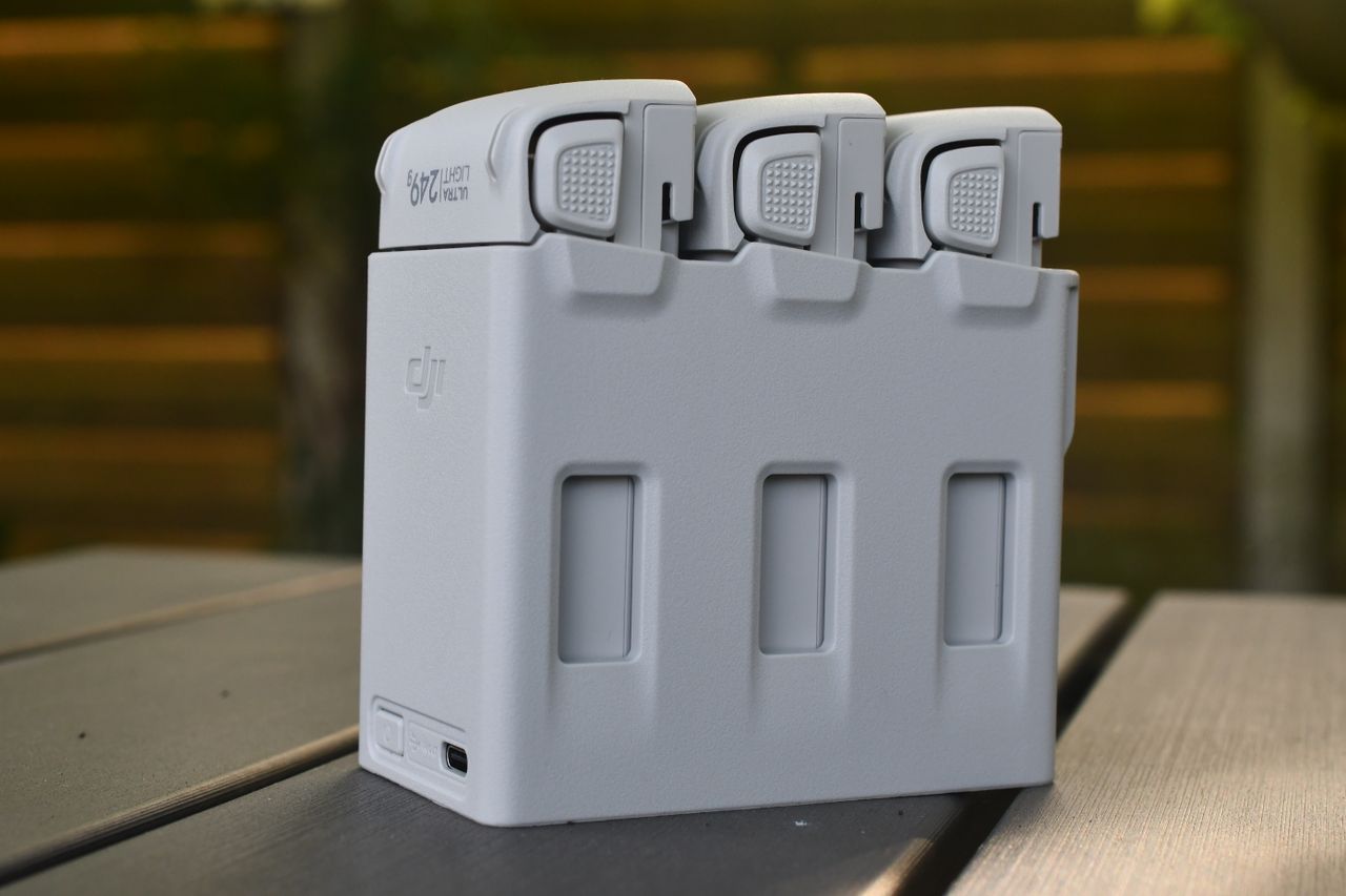 Close-up of a drone battery pack outdoors, showcasing a sleek, modern design.